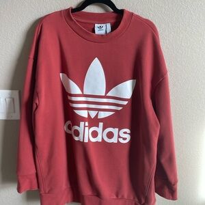 Adidas sweatshirt 
Burnt orange with white logo 
Great condition …